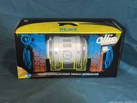 Front box view showing Ollie robot in packaging emblazoned with branding and key features.