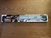 Long horizontal box showing ISO 7X branded exercise bar packaging with claims of building strength and lean muscle fast.
