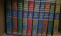 Photo of 10 Collier's Junior Classics hardcover books in various colors with titles, volume numbers, and gold illustrations on spines.