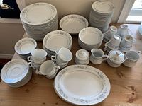 Overview photo showing all dinnerware items arranged on table