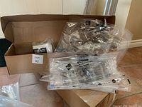 Photo of opened box showing 3 medium, 3 jumbo vacuum-seal bags plus 2 hanging bags