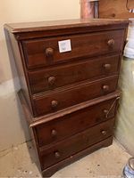 Full front view of the dresser showing six drawers and overall condition, including surface wear and finish.
