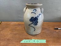 Front view of the antique crock showing blue floral decoration and number 2.