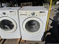 Right-side front view of LG Tromm washer next to dryer