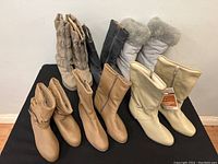Five pairs of Kaufman Defrosters ladies boots displayed showing various colors and styles.