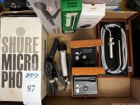 Overhead view of microphones and accessories arranged in tray