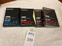 Four Sony Elcaset LC-60 tapes shown, two sealed FeCr Type II and two opened tapes (one FeCr, one SLH).