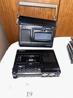 Recorder and carry case displayed front-facing on wood backdrop