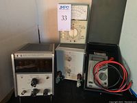 Lot showing all four items together: HP 5221B electronic counter, Heathkit IM-104 meter, HP 350D attenuator, and Micronta multimeter in case with leads.