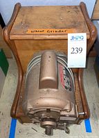 Top view of vintage wheat grinder showing wooden housing and motor front