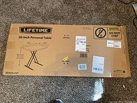 Box of Lifetime 30-Inch Personal Folding Table showing brand and measurements.