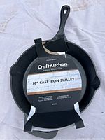 Photo of CraftKitchen Classic Collection 10-inch cast iron skillet with original packaging showing product details.