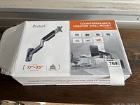 Photo of the Brateck Counterbalance Monitor Wall Mount box showing product image with arm and specifications for 17-35 inch screen compatibility.