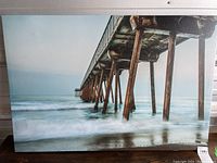 Full front view of the canvas print showing pier over ocean scene.