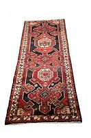 Full front view of long narrow runner rug showing overall geometric pattern and color scheme