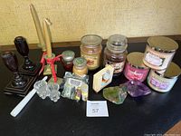 Photo of entire lot showing jar candles, candlesticks, diffuser kit, and bottle-shaped soaps.