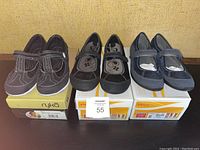 Three pairs of ladies orthotic shoes, two Orthaheel and one Ryka, all new in box.