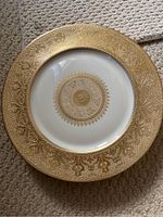 Heinrich & Co. 10 inch gold rim porcelain dinner plate showing detailed gold embossed intricate design