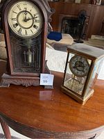 Both clocks side by side on table