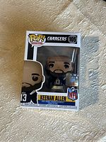 Front view of boxed Keenan Allen Funko Pop #105 figure showing packaging condition and figure details.
