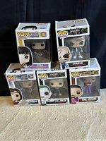 Front view of all five Funko Pop boxes stacked, showing character names and numbers.