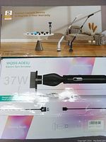 Box showing electric spin scrubber with ergonomic handle, black color, USB charging cable, and 37W power specification