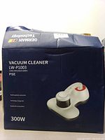 Front view of the vacuum cleaner box showing brand PSE model LW-P1003, 300W power, German technology branding.