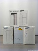 Five sensor soap dispensers in original YikHom branded boxes, front view