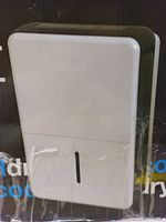 Front view of the Senville 22 pint dehumidifier showing its white body with a black top and water level indicator.