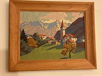 Full view of framed paint by numbers artwork showing a mountainous landscape with a campanile tower and buildings under a cloudy sky.