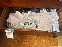Drawer with several folded men's Oxford dress shirts by Stanford, light colored and striped, size 17 36-37, some with tags