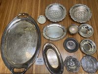 All items overview showing the various trays, bowls, candy dish, trivet and coaster displayed on wooden surface.