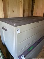 Photo of the Keter resin garden box showing full side and top view, dusty surface needing cleaning.