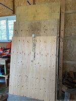 Front view of stacked plywood sheets showing full faces