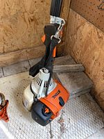 Engine assembly with shoulder strap and handle in view