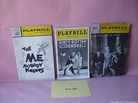 Three vintage Playbills placed side by side against a plain background labeled with 'Lot 28'.