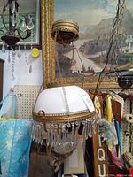 Full view of hanging lamp including chain and ceiling mount showing overall design and size.