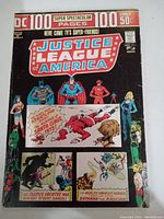 Front cover of Justice League of America comic issue #110 showing superheroes and storyline highlights