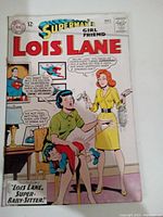 Front cover of Superman's Girlfriend Lois Lane Comic #57 showing Lois Lane with a young boy bent over a stool, labeled as Super-Baby-Sitter.