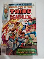 Front cover of Marvel Two-in-One #27 comic book showing The Thing versus Deathlok scene at the US Capitol building with additional characters and text.