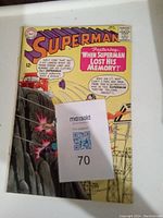 Front cover of a 1965 Superman comic book showing Superman and a dramatic explosion with story title about memory loss.