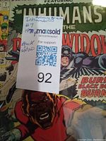 Front cover of The Inhumans & The Black Widow comic book, showing issue #7 from 1971 and part of the detailed comic artwork with characters in action.