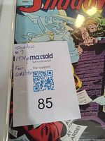 Close-up of The Shadow comic book cover with auction lot number and condition noted as fair used.