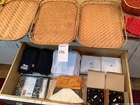 Three rectangular wicker baskets displayed on counter.