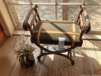 Overview of chair and planter side by window