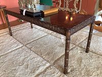 Full view of desk showing rectangular top, carved aprons and painted legs