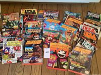 Overview of laid-out magazines including Nintendo Power, Electronic Gaming Monthly and Tips & Tricks