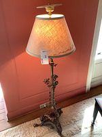 Full view of the standing lamp showing fabric shade and overall design