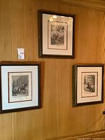 Three framed Ridinger equestrian prints mounted on wood-paneled wall