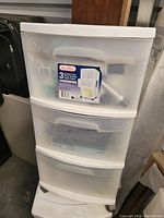 Front view of one Sterilite 3-drawer plastic rolling cabinet with sticker label on top drawer.